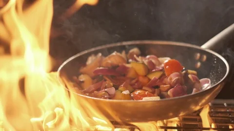 Vegetables flying into the pan in slow motion. Onions, broccoli, mushrooms Stock Footage 108610273