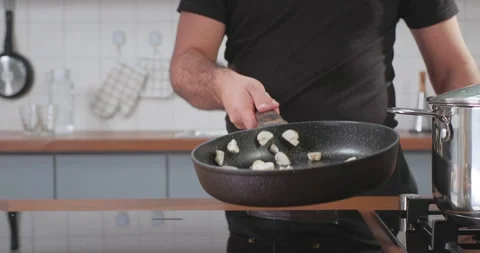 Vegetables flying into the pan in slow motion. Fresh mushrooms champignons Stock Footage 252393510