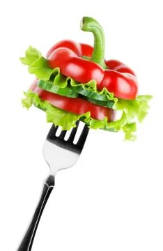 Vegetables on the fork Stock Photos