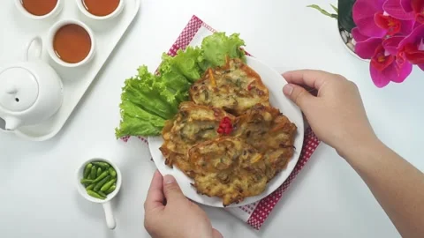 Vegetables Fried or Bakwan goreng or Bala bala is a traditional food from I.. Stock Footage 243799473
