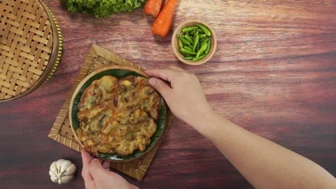 Vegetables Fried or Bakwan goreng or Bala bala is a traditional food from I.. Stock Footage 243799494