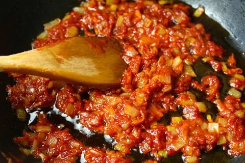 Vegetables fried in sauce. Stock Photos