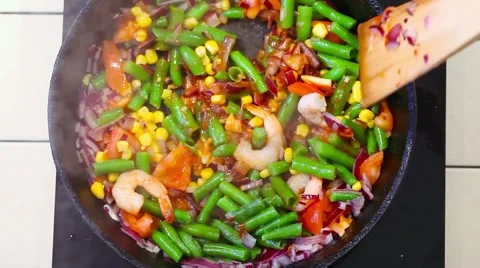 Vegetables frying pan on top Stock Footage 65796894