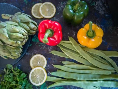 Vegetables from the garden in composition on dark background Stock Photos
