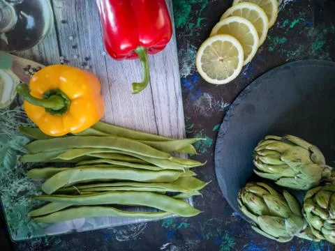 Vegetables from the garden in composition on dark background Stock Photos