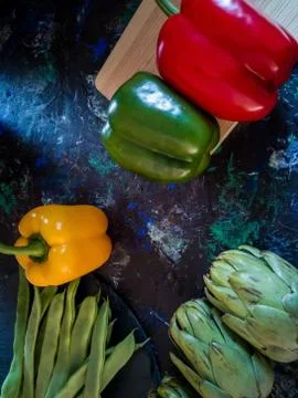 Vegetables from the garden in composition on dark background Stock Photos