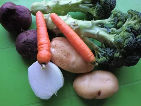 Vegetables on a green background, broccoli, beets, carrots.  Photo healthy food. Stock Photos