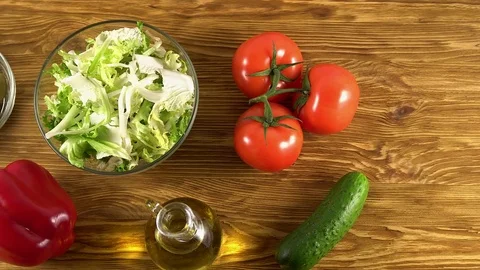 Vegetables ingridients for salad on rustic wooden background. Stock Footage 74715955