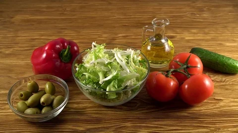 Vegetables ingridients for salad on rustic wooden background. Video stock 74767442