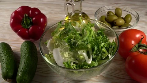 Vegetables ingridients for salad on rustic wooden background. Video stock 74777975