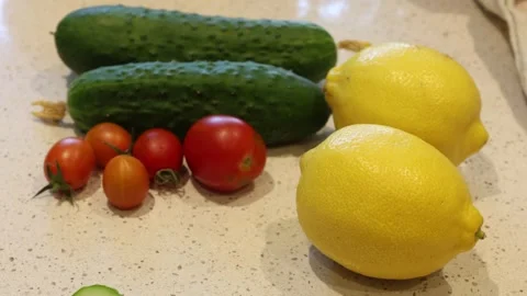 Vegetables. Lemon, cucumber and tomatoes. Stock Footage 315247005