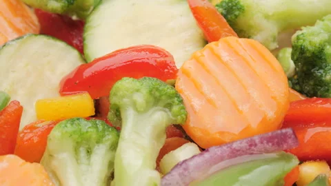Vegetables mix in ice glaze close up, rotation. Healthy vegan food concept Stock Footage 225072575