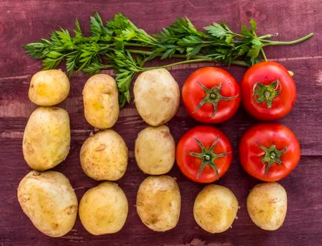 Vegetables on old wood surface Stock Photos