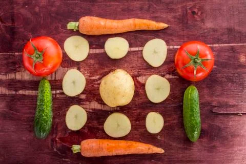 Vegetables on old wood surface Stock Photos