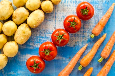 Vegetables on old wood surface Stock Photos