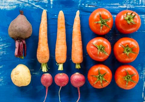 Vegetables on old wood surface Stock Photos