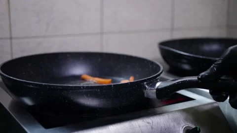 Vegetables in a pan cook carrots in the kitchen Stock Footage 142035645
