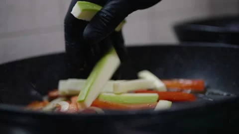 Vegetables in a pan cook carrots in the kitchen Video stock 142035693