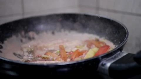Vegetables in a pan cook carrots in the kitchen Stock Footage 142035748