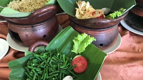 Vegetables placed in an antique clay dish, hotel restaurant, 4K Stock Footage 222704179
