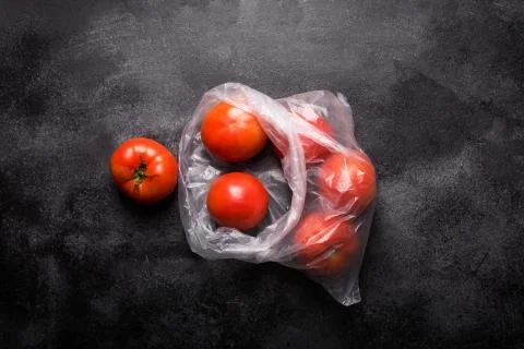 Vegetables in plastic bag on a dark background Fotos de archivo