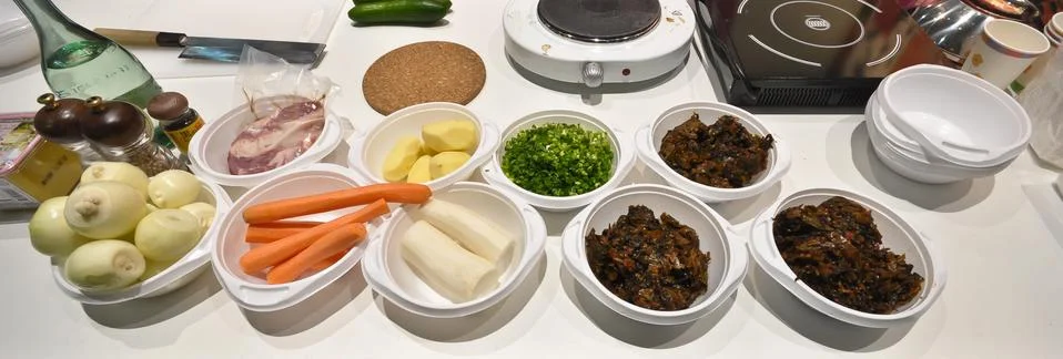 Vegetables in plastic plates on a table Stock Photos