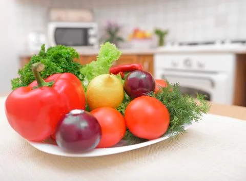 Vegetables on the plate in kitchen. Stock Photos