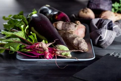 Vegetables on a plate with notebook Foto stock