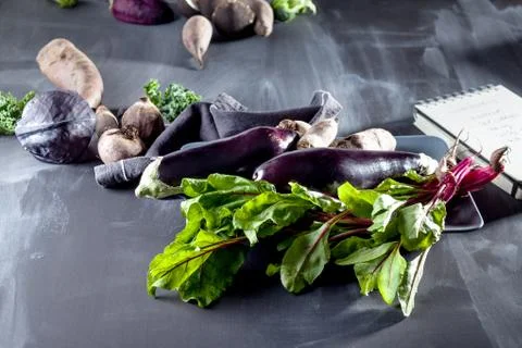 Vegetables on a plate with open notebook Stock Photos