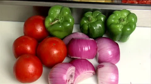 Vegetables at prep station 02, tomatoes, green peppers &amp; red onions Stock Footage 24632507