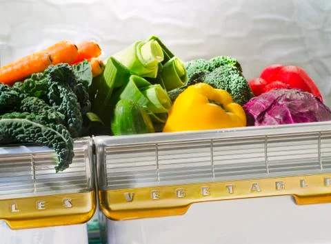 Vegetables in retro refrigerator bin Stock Photos