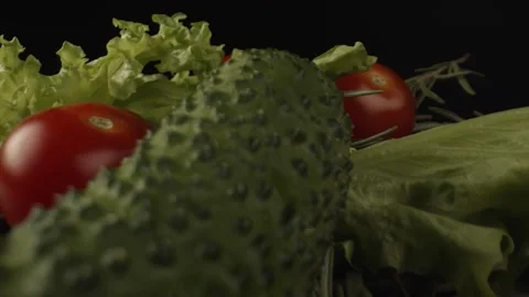 Vegetables for salad are located on the kitchen table. Green lettuce, red tomato Stock Footage 164145806