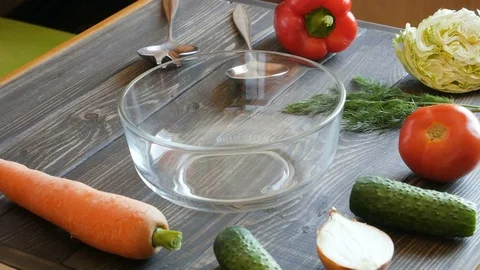 Vegetables for salad. Tomato cabbage onion cucumber carrot pepper on a wooden bo Stock Footage 77160818