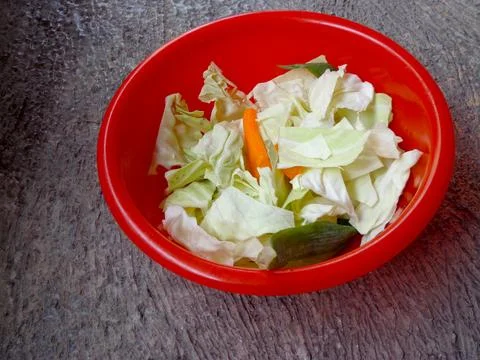 The vegetables shown are chopped cabbage and carrots 스톡 사진