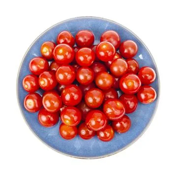Vegetables. Small red cherry tomatoes isolated on white Stock Photos