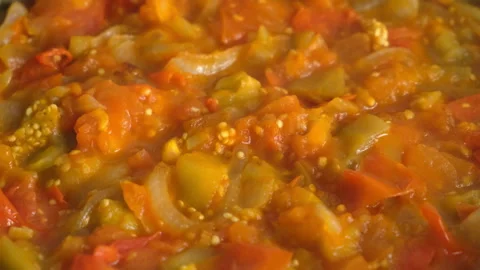 Vegetables stew cooking in frying pan on kitchen close up view. Stock Footage 312468606
