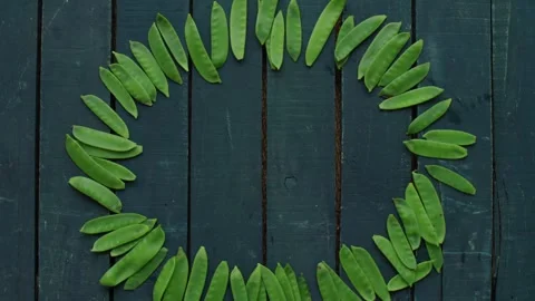 Vegetables Stop Motion Animation Featuring Fresh Green Snow Peas in a Circle Stock Footage 331101383