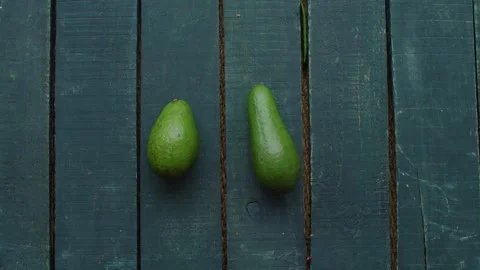 Vegetables Stop Motion Animation Featuring Fresh Avocados on Wooden Planks Видео 331101423