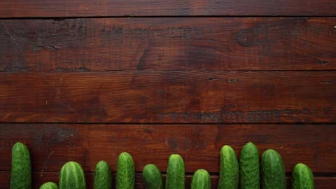 Vegetables Stop Motion Animation with Fresh Cucumbers on Dark Rustic Wood 库存影片 331101463