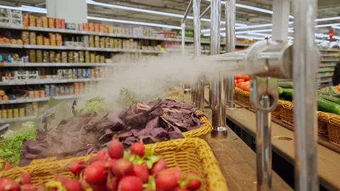 Vegetables in the store on the counter with a humidifier Stock Footage 168412806