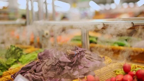 Vegetables in the store on the counter with a humidifier Stock Footage 168412888