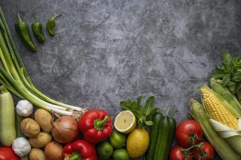 Vegetables on table  and in the center a empty writing space.Cooking concept. Stock Photos