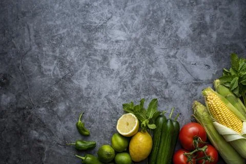 Vegetables on table  and in the center a empty writing space.Cooking concept. Stock Photos