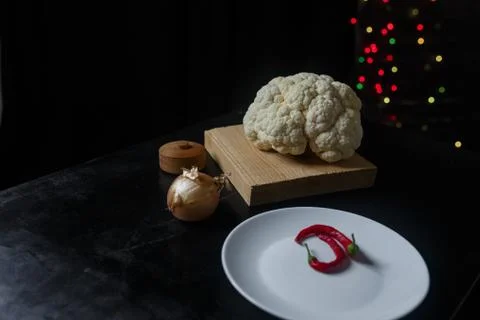 Vegetables on the table. Cauliflower, red pepper and onion Stock Photos