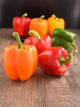 Vegetables on table. Pepper orange, red, green color. Stock Photos