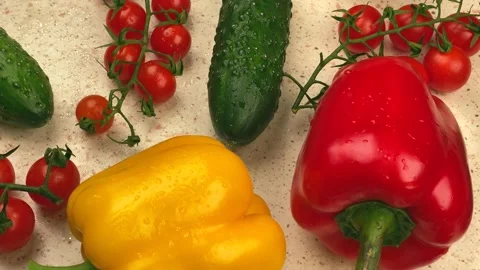 Vegetables - tomato, cucumber, pepper and bow on the kitchen table. Stock Footage 149756796