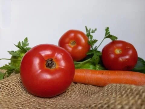Vegetables, tomatoes, in a white background Stock Photos