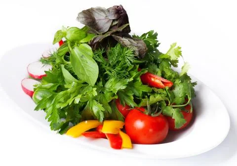 Vegetables on a white plate Stock Photos