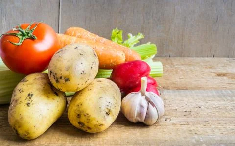 Vegetables on wooden background Stock Photos