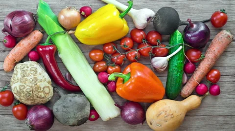 Vegetables on wooden background, stop motion animation, 4K. Stock Footage 63244933